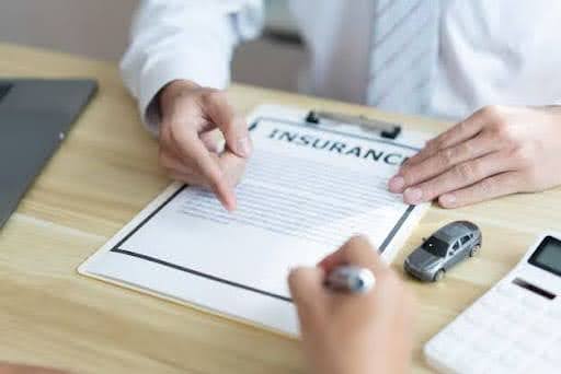Client shaking hands with an insurance broker after selecting a policy.jpg