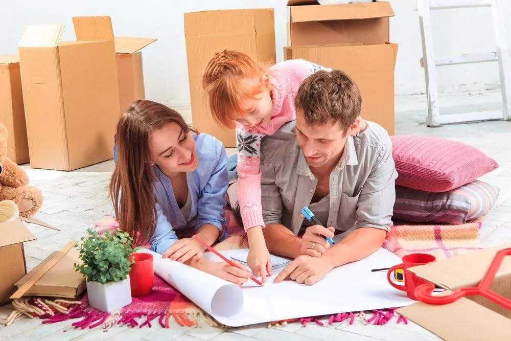 a couple playing with their daughter.webp