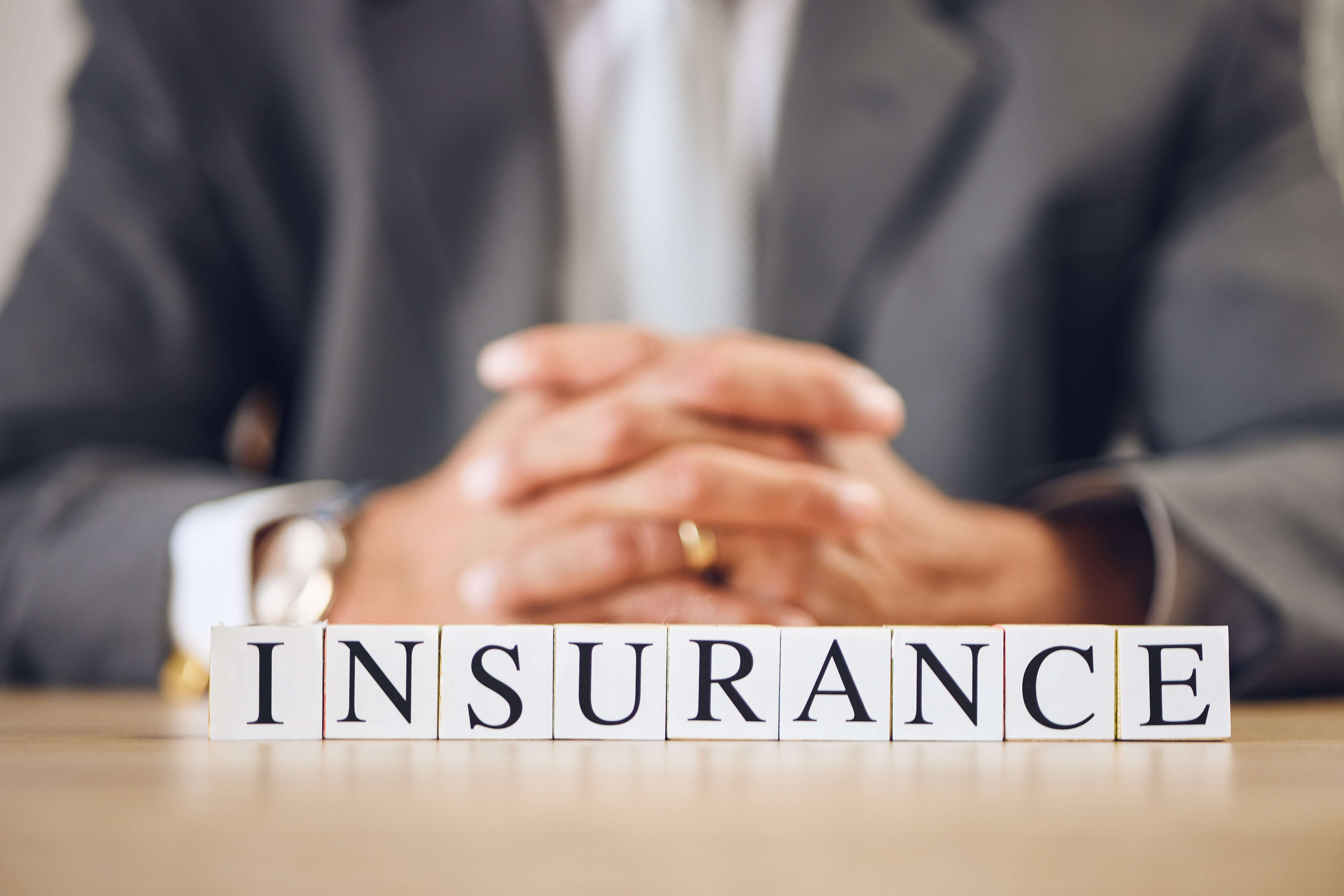 business-person-hands-and-blocks-for-insurance-f-2026-01-09-11-43-45-utc.jpg