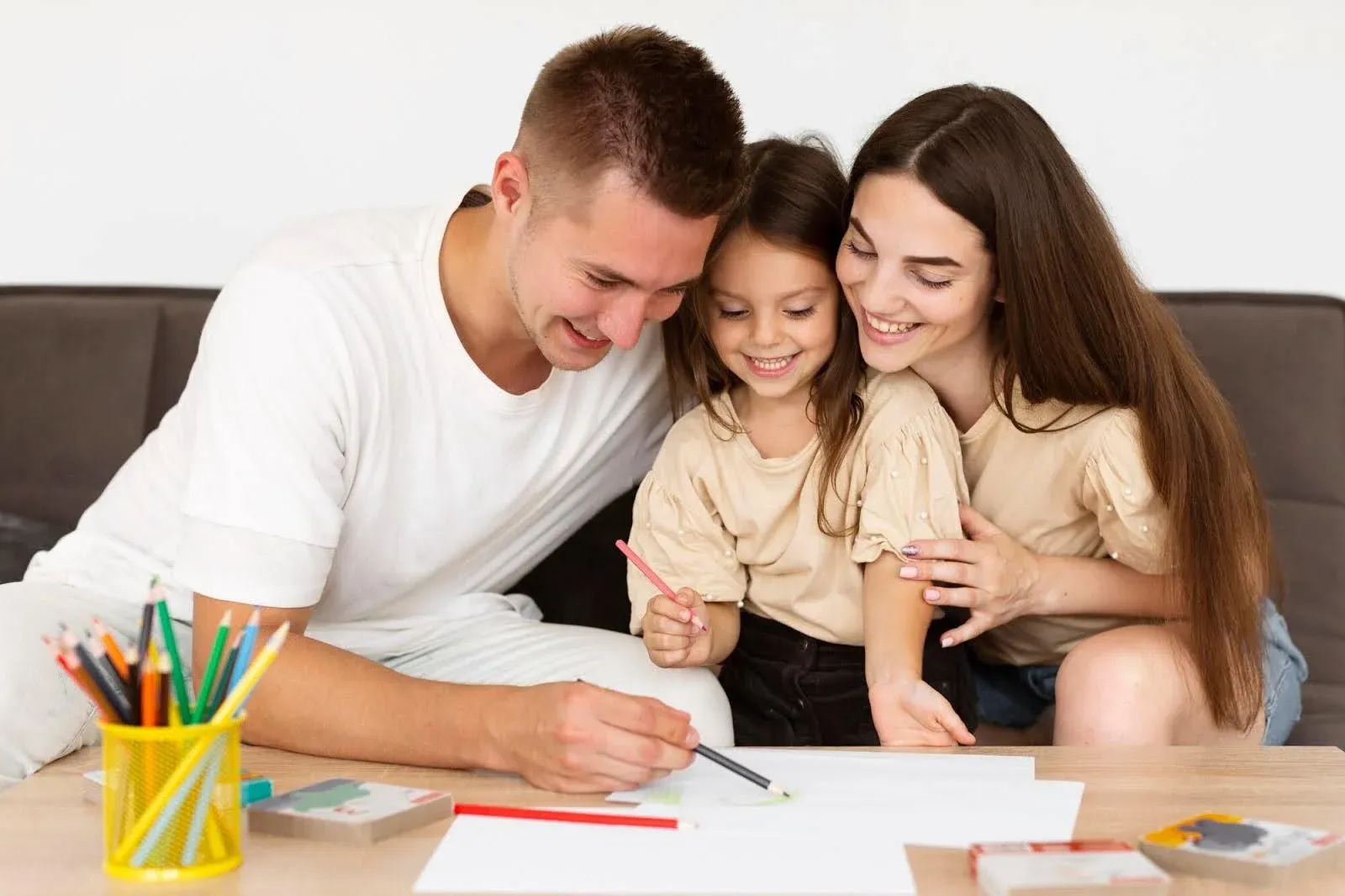 couple coloring with their daughter.webp