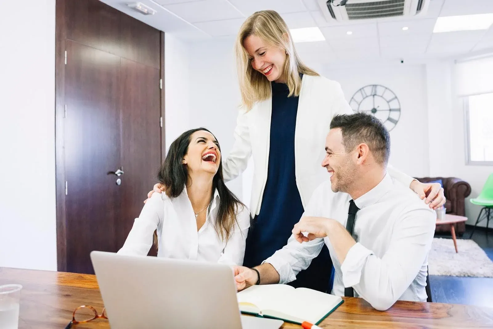 doctors laughing while talking to each other.webp