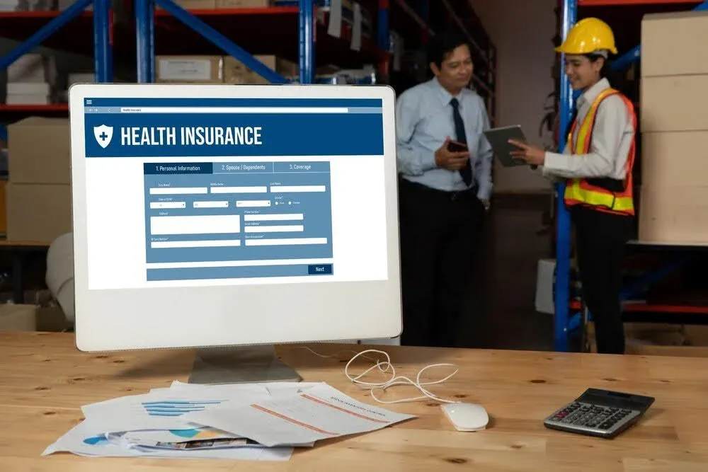 health insurance form open in a computer at. a workplace.webp