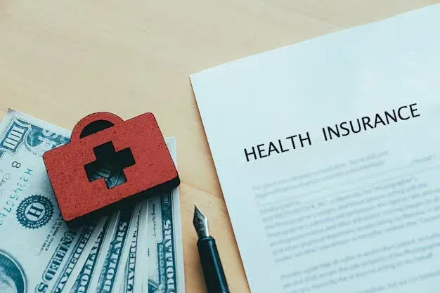 health insurance form with money and pen.webp