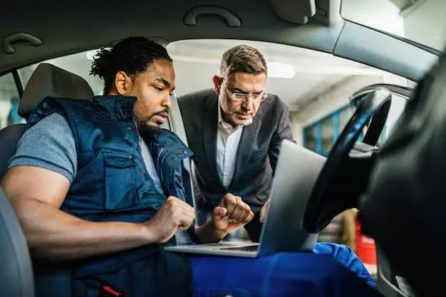 insurance agent discussing auto insurance policy with client.webp