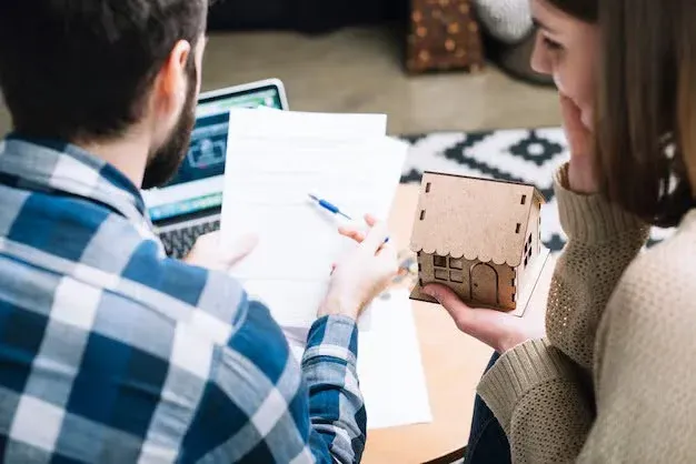 man explaining a form to his partner.webp