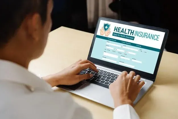 person exploring health insurance on a laptop.webp