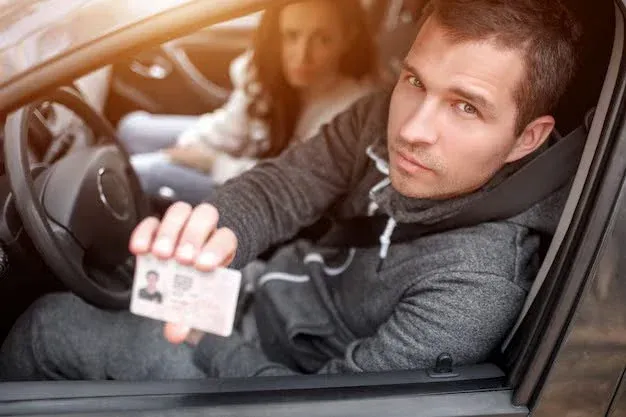 person showing his driving license.webp